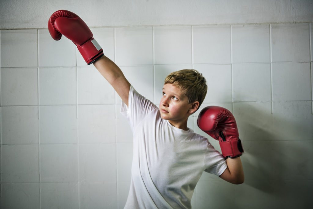 Boy with boxing gloves