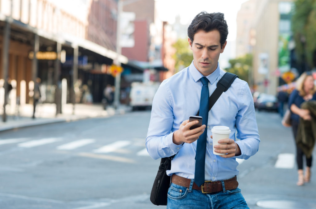 Man writing email on phone