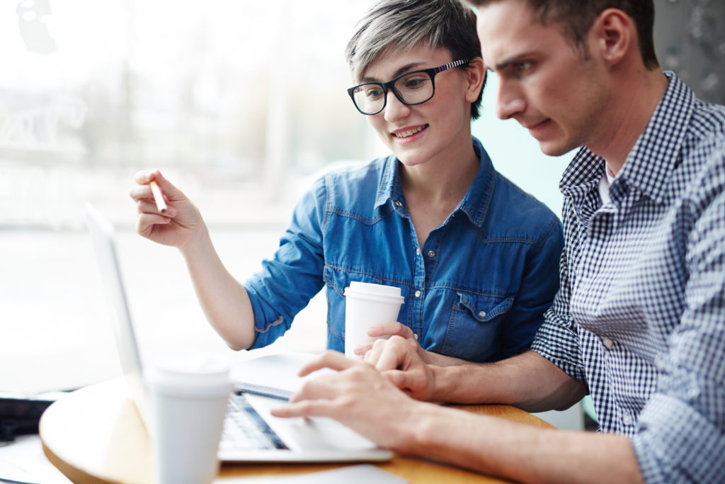 Co-working traders discussing pay-per-call sales information online